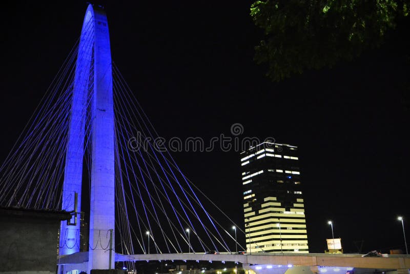 S�o Jos� dos Campos, April 5, 2024: The beautiful view of the lights of the Colinas Green Tower and the Juana Blanco Arch of Innovation cable-stayed bridge. S�o Jos� dos Campos, April 5, 2024: The beautiful view of the lights of the Colinas Green Tower and the Juana Blanco Arch of Innovation cable-stayed bridge