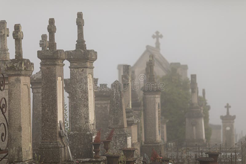 The view of the misty graveyard. Lowyat cemetery, city of Limoges, France. The view of the misty graveyard. Lowyat cemetery, city of Limoges, France