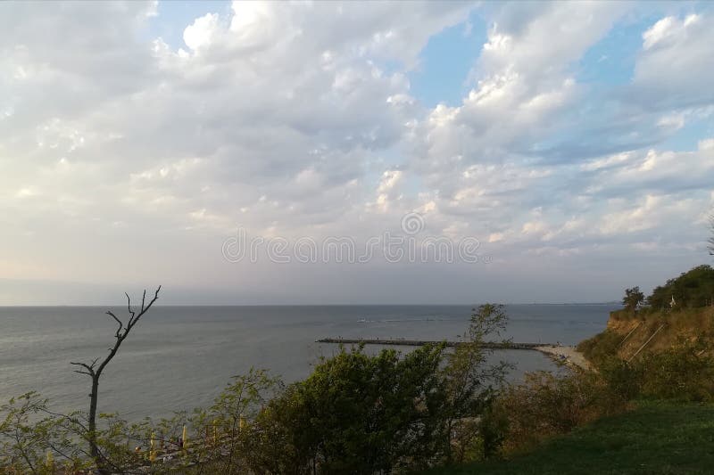 View of the Black Sea from the High Coast in Anapa. In the distance you can see the beach  pier  sky and clouds. View of the Black Sea from the High Coast in Anapa. In the distance you can see the beach  pier  sky and clouds.