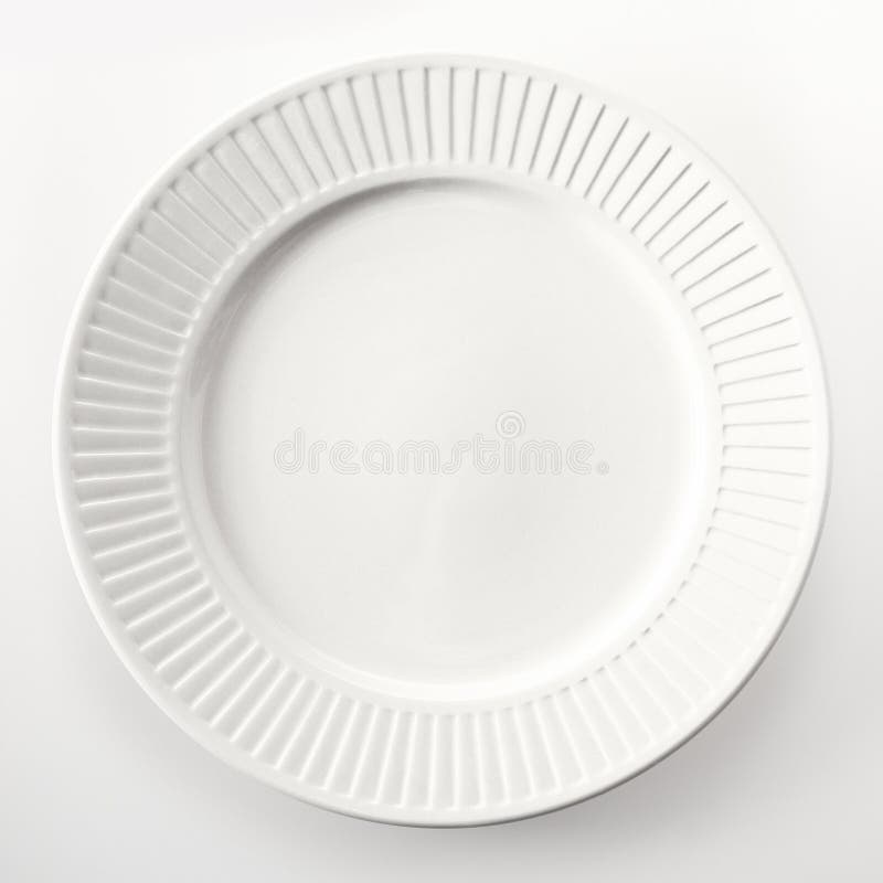 Close up High Angle View of an Empty Round White Dinner Plate Isolated on White Background. Close up High Angle View of an Empty Round White Dinner Plate Isolated on White Background.