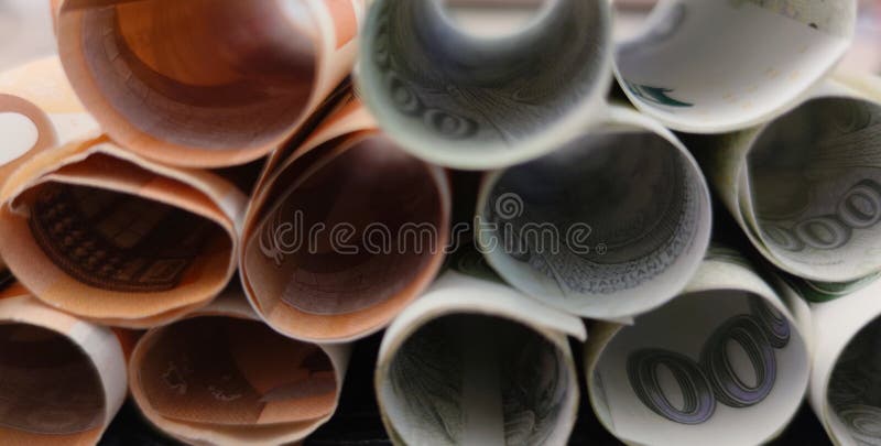 Close-up view of Euro banknotes rolled into a roll stacked on top of each other, photo. Close-up view of Euro banknotes rolled into a roll stacked on top of each other, photo