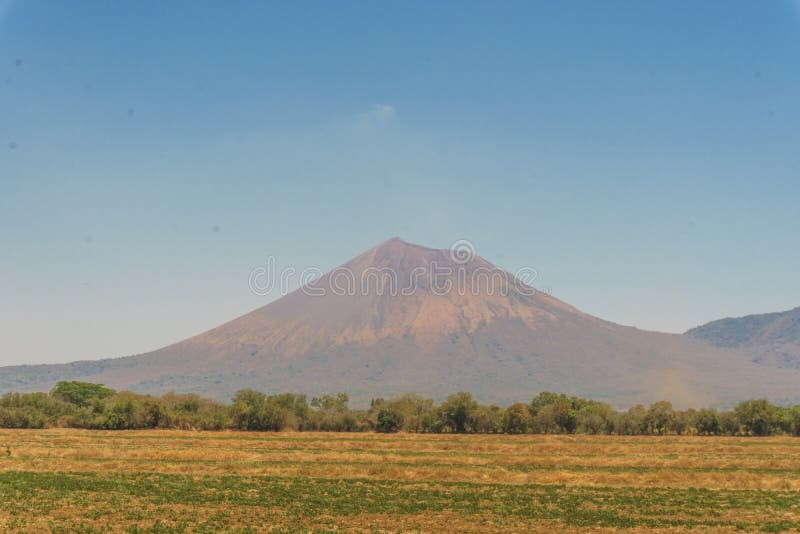 Natural landscape with a degraded sky of blue and whiteelica Volcano at background in Leon, Nicaragua, Central America. Natural landscape with a degraded sky of blue and whiteelica Volcano at background in Leon, Nicaragua, Central America