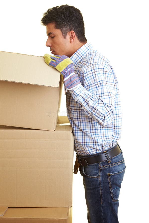 Worker looking into a cardboard box. Worker looking into a cardboard box
