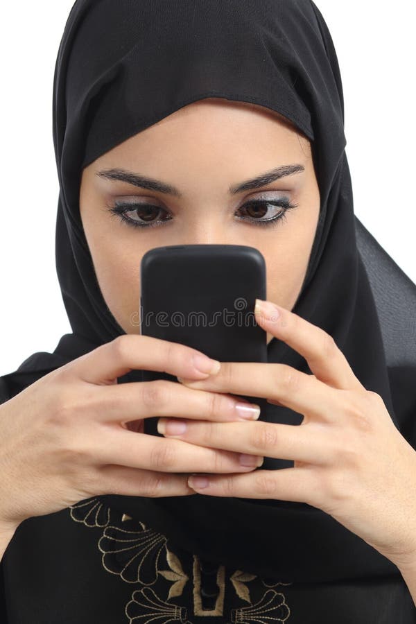 Front view of an arab woman addicted to the smart phone isolated on a white background. Front view of an arab woman addicted to the smart phone isolated on a white background