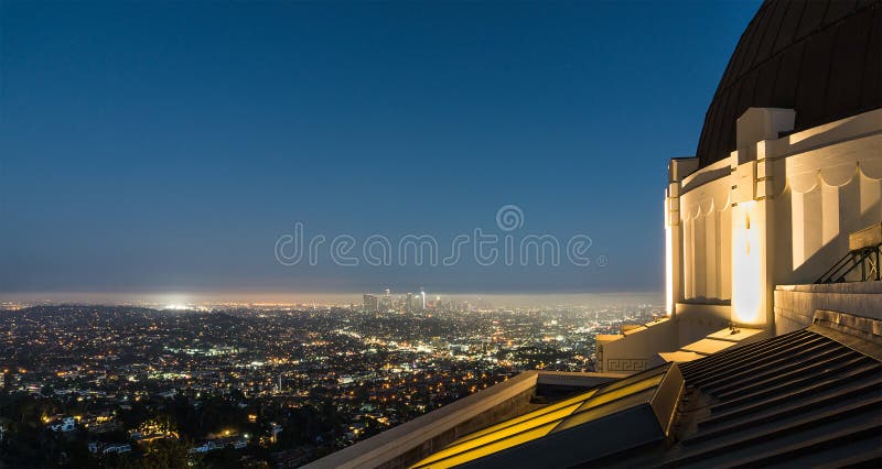View to Los Angeles Downtown at night from Griffith Observatory. Beautiful panorama cityscape from tourist attraction. View to Los Angeles Downtown at night from Griffith Observatory. Beautiful panorama cityscape from tourist attraction.