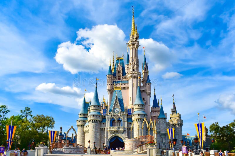 Orlando, Florida. March 19, 2019. Panoramic view of Cinderella`s Castle on lightblue cloudy sky background in Magic Kingdom at Walt Disney World  1. Orlando, Florida. March 19, 2019. Panoramic view of Cinderella`s Castle on lightblue cloudy sky background in Magic Kingdom at Walt Disney World  1