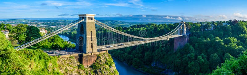 Panoramic view of Bristol suspension bridge at sunset, showing the bridge, avon gorge, forest an houses. Panoramic view of Bristol suspension bridge at sunset, showing the bridge, avon gorge, forest an houses.