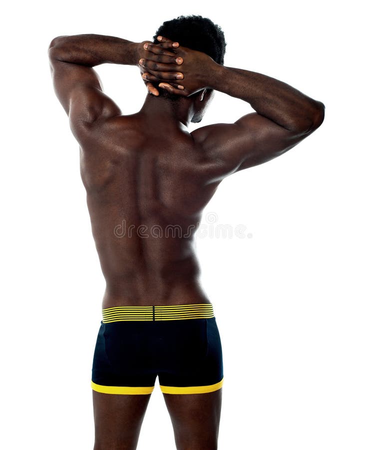 Vista posterior del hombre joven muscular fotografía de archivo Vista posterior del hombre joven muscular fotografía de archivo