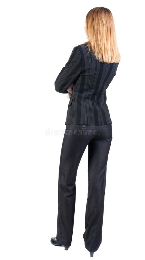 Vista posteriore di stare la bella donna bionda di affari immagine stock libera da diritti Vista posteriore di stare la bella donna bionda di affari immagine stock libera da diritti