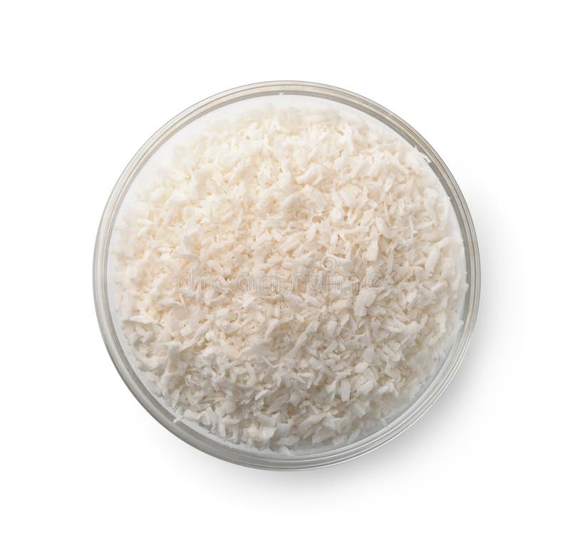 Vista superiore della ciotola di vetro con i trucioli della noce di cocco immagini stock libere da diritti Vista superiore della ciotola di vetro con i trucioli della noce di cocco immagini stock libere da diritti