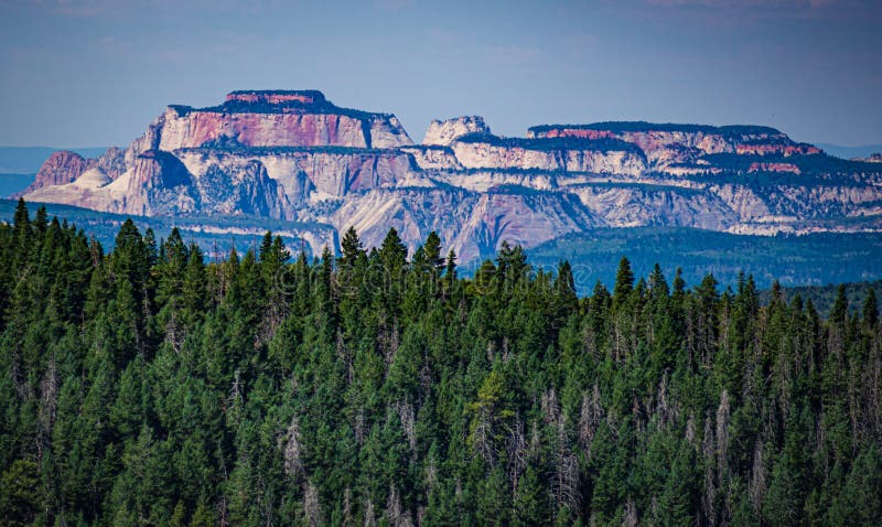 A mountain tip vista looking towards Zion NP in Utah
approximately 50 miles away in midday. A mountain tip vista looking towards Zion NP in Utah
approximately 50 miles away in midday.