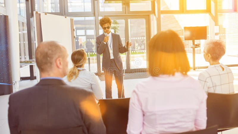 Visually impaired speaker at inclusion lecture in the office in front of a business team