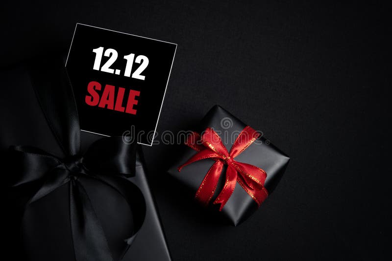 Top view of black gift box with black background with copy space for text 12.12 singles day sale. Online shopping of China, 12.12 singles day sale concept. Top view of black gift box with black background with copy space for text 12.12 singles day sale. Online shopping of China, 12.12 singles day sale concept