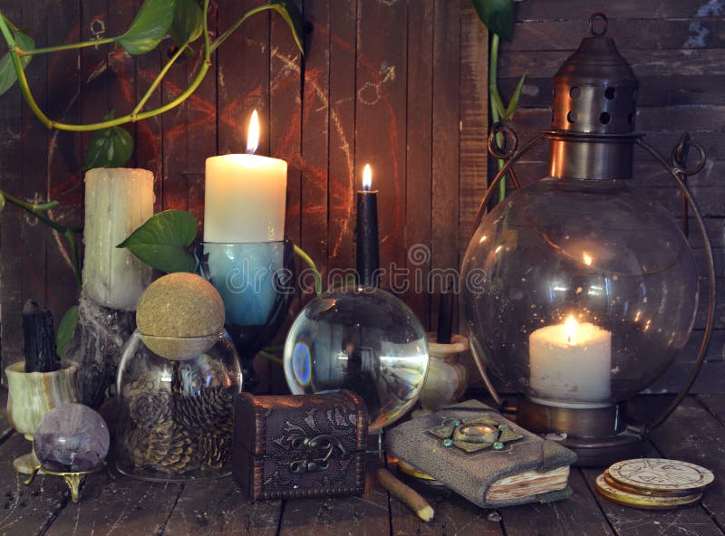 Wicca, esoteric and occult still life with vintage magic objects on witch table altar for mystic rituals and fortune telling. Halloween and gothic concept. Wicca, esoteric and occult still life with vintage magic objects on witch table altar for mystic rituals and fortune telling. Halloween and gothic concept