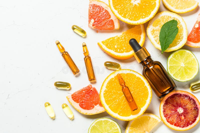 Vitamin C. Cosmetic products and fresh citrus fruits.