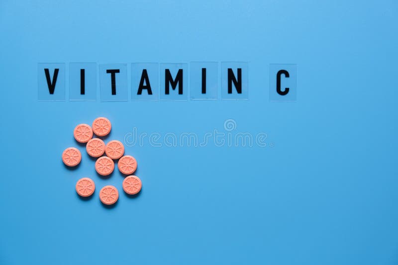Vitamin c word on blue background