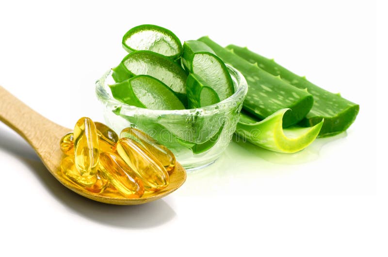 Vitamin E capsules and sliced Aloe Vera.