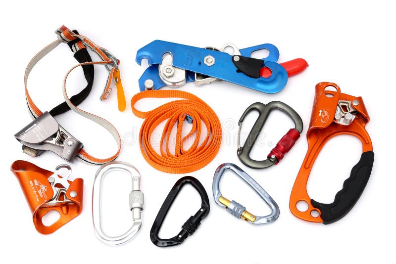 Isolated Rock Caving and climbing devices: ascender, descender, locking carabiners, quick ascender. Isolated Rock Caving and climbing devices: ascender, descender, locking carabiners, quick ascender