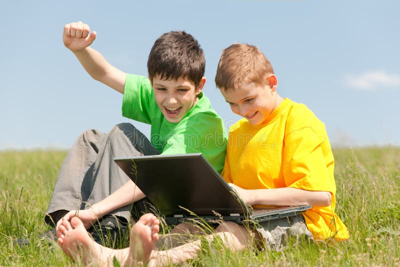 Two boys has got a computer victory and show their feelings about it. Two boys has got a computer victory and show their feelings about it