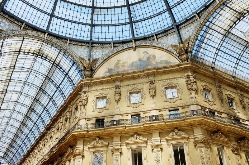 The Galleria Vittorio Emanuele II is a covered double arcade formed of two glass-vaulted arcades at right angles intersecting in an octagon, prominently sited on the northern side of the Piazza del Duomo in Milan. The Galleria Vittorio Emanuele II is a covered double arcade formed of two glass-vaulted arcades at right angles intersecting in an octagon, prominently sited on the northern side of the Piazza del Duomo in Milan