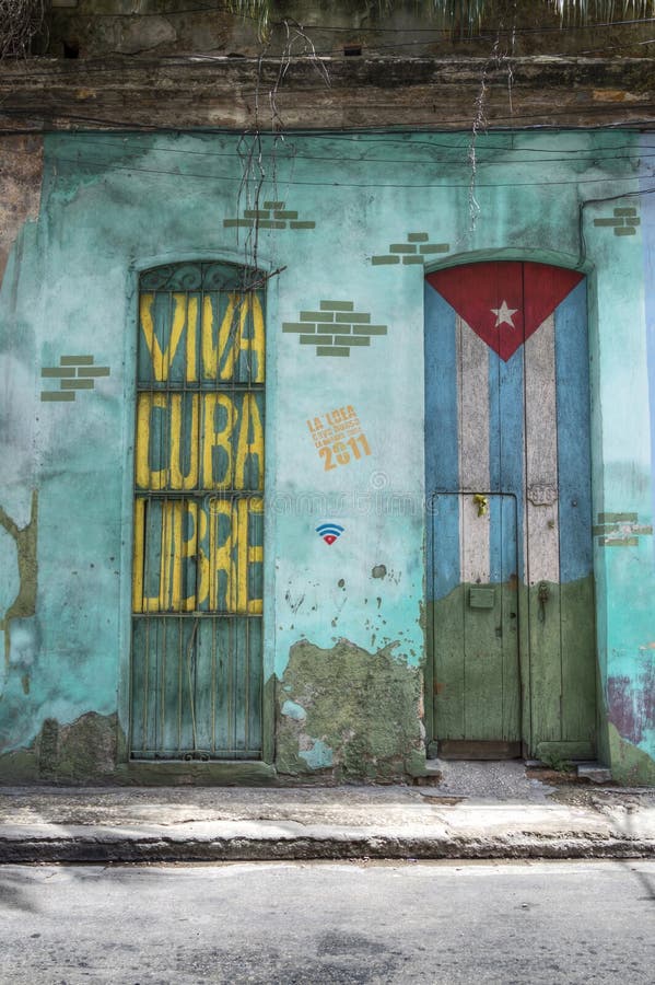 Viva Cuba Libre. A patriotic writing and a door painted with the cuban flag, Havana, Cuba Viva Cuba Libre. A patriotic writing and a door painted with the cuban flag, Havana, Cuba