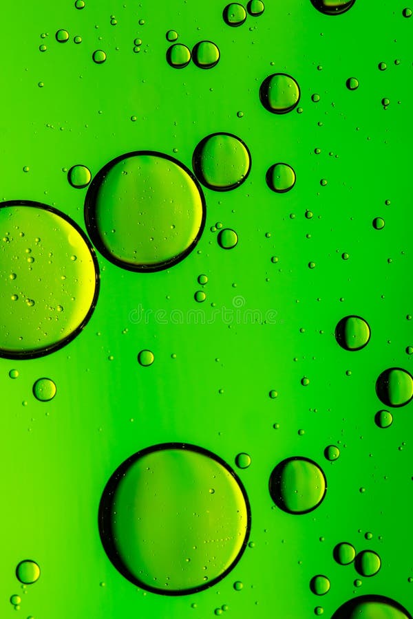 Vivid green oil and water abstract background stock images