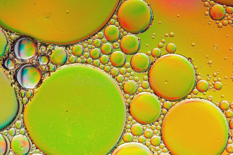 Vivid orange and green trippy psychedelic abstract stock images