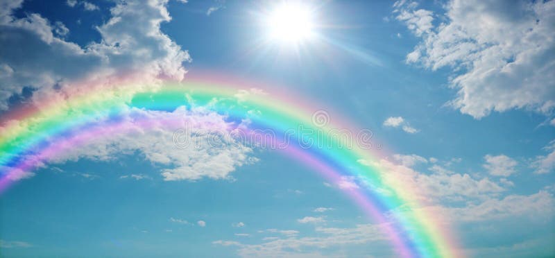 Wide blue sky with pretty clouds, a bright sun shining centre top and a large rainbow arcing from left to right with copy space. Wide blue sky with pretty clouds, a bright sun shining centre top and a large rainbow arcing from left to right with copy space