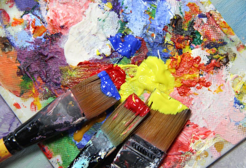 Vivid strokes and paintbrushes stock images