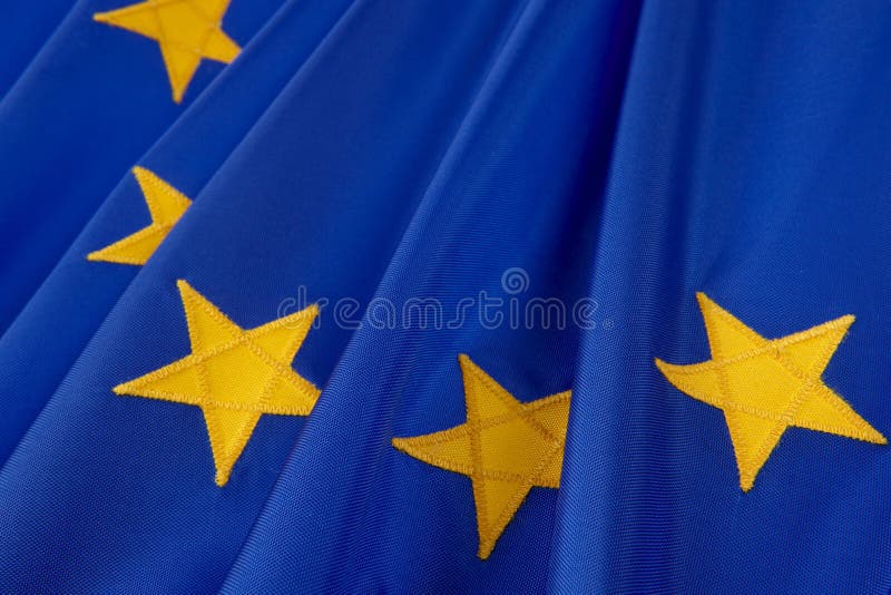 Macro shot of European Union flag detailing yellow stars. Macro shot of European Union flag detailing yellow stars