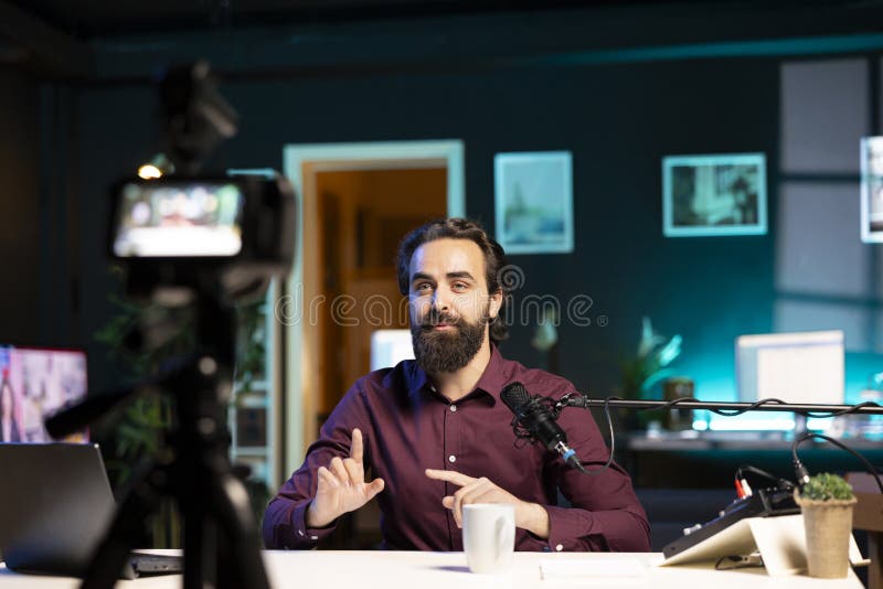 Vlogger presenting informations during streaming service broadcast filmed high tech gear royalty free stock images