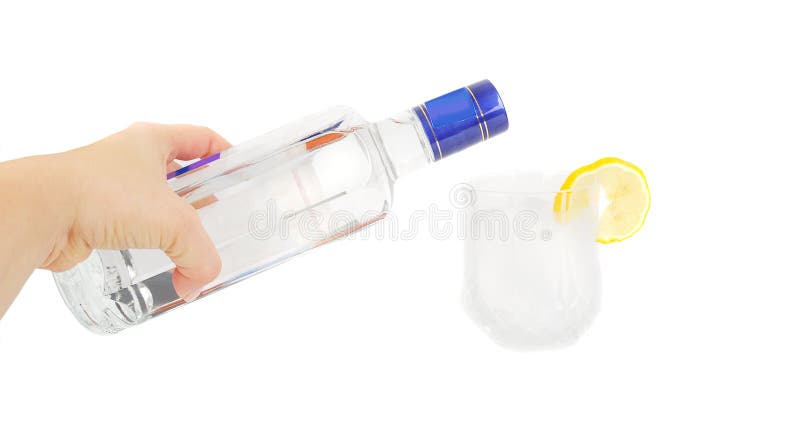 Human woman arm with vodka bottle put alcohol on the glass on the white background. Human woman arm with vodka bottle put alcohol on the glass on the white background.