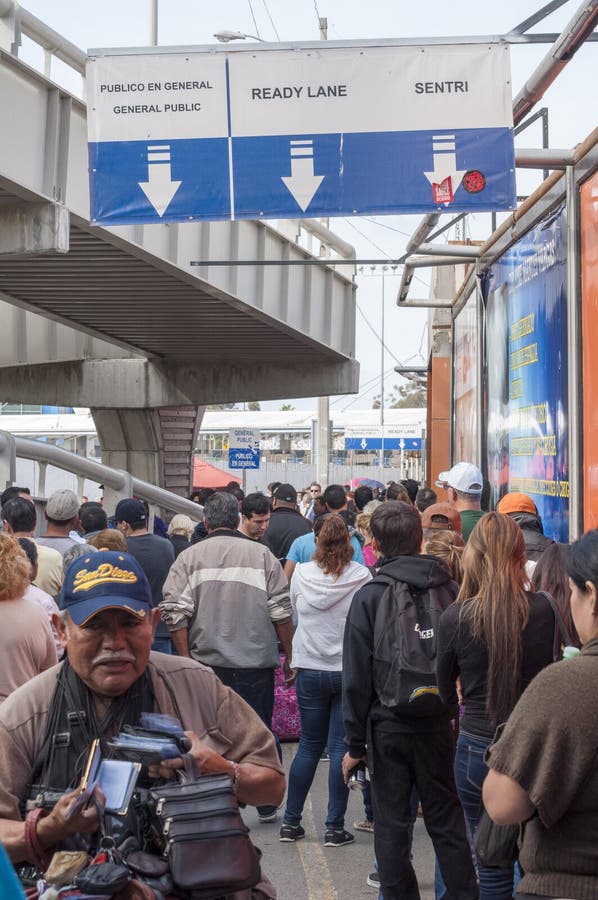 TIJUANA, MEXICO - NOVEMBER 13, 2014: Despite the existence of three seperate lines, the pedestrian border crossing from Tijuana, Mexico to the United States remains a long wait. TIJUANA, MEXICO - NOVEMBER 13, 2014: Despite the existence of three seperate lines, the pedestrian border crossing from Tijuana, Mexico to the United States remains a long wait