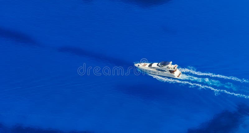 Aerial view of single yacht in azure sea, vacation and travel concept. Aerial view of single yacht in azure sea, vacation and travel concept