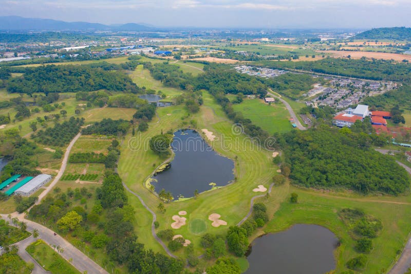 Aerial view of Golf Course Club and hotel resort. Green natural garden park in sport and recreation concept. Aerial view of Golf Course Club and hotel resort. Green natural garden park in sport and recreation concept.