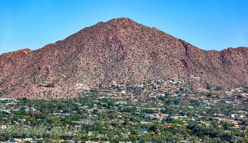 Aerial view of the south face of Camelback Mountain with upscale homes in Phoenix, Arizona. Aerial view of the south face of Camelback Mountain with upscale homes in Phoenix, Arizona