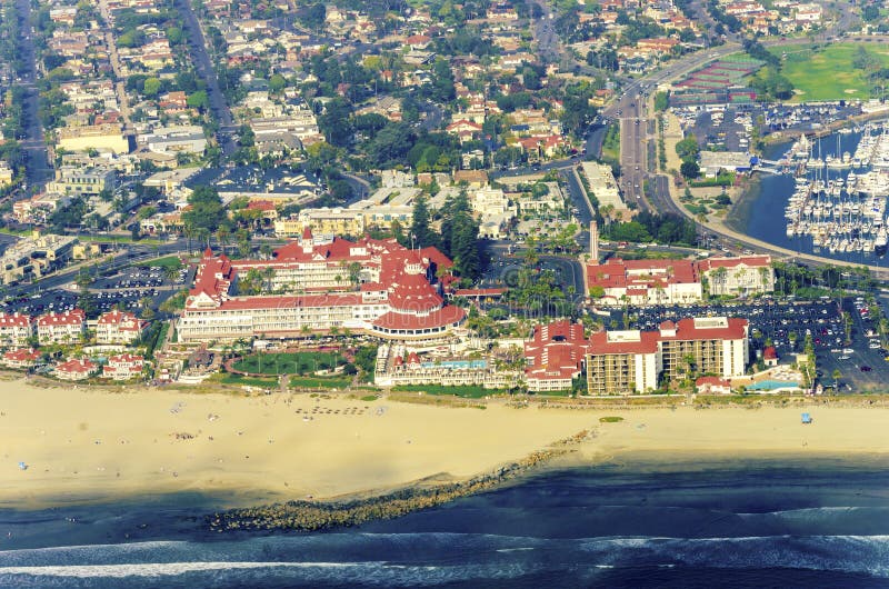 Aerial view of the Coronado island and in the San Diego Bay in Southern California, United States of America. A view of the Skyline of the city, the pacific ocean and the historic Hotel Del Coronado. Aerial view of the Coronado island and in the San Diego Bay in Southern California, United States of America. A view of the Skyline of the city, the pacific ocean and the historic Hotel Del Coronado.