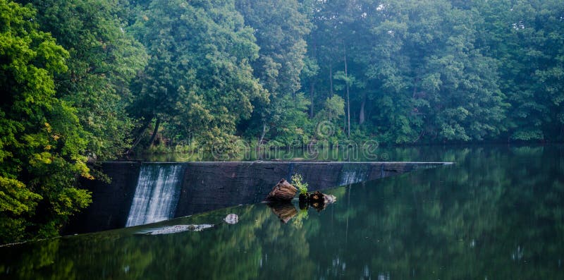 Man made waterfall sliced into nature. Man made waterfall stock images, royalty-free photos and pictures