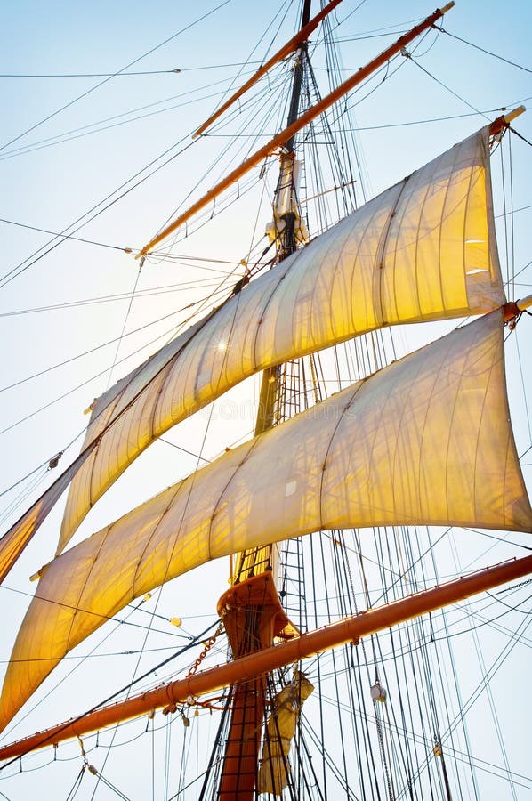 The sun shinning behind the tall ship mask, sails and riggings at the annual Festival of the Sails in San Diego, California. The sun shinning behind the tall ship mask, sails and riggings at the annual Festival of the Sails in San Diego, California.