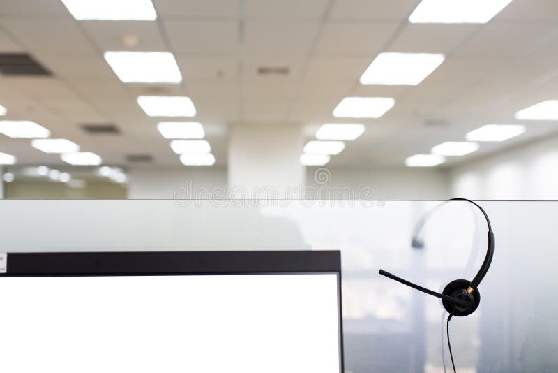 VOIP headset for callcenter on desk at customer service office. Communication support for sale support and telemaketing Helpdeskac