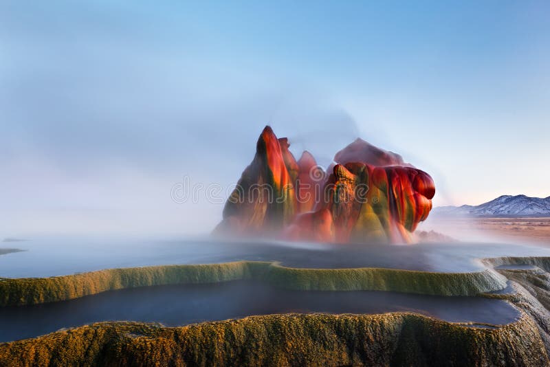 Fly Geyser near Black Rock Desert is an accidentally man made natural phenomenon in Nevada. Constantly spewing hot water and minerals, the formation constantly adds color and terraced pools of water. Fly Geyser near Black Rock Desert is an accidentally man made natural phenomenon in Nevada. Constantly spewing hot water and minerals, the formation constantly adds color and terraced pools of water.