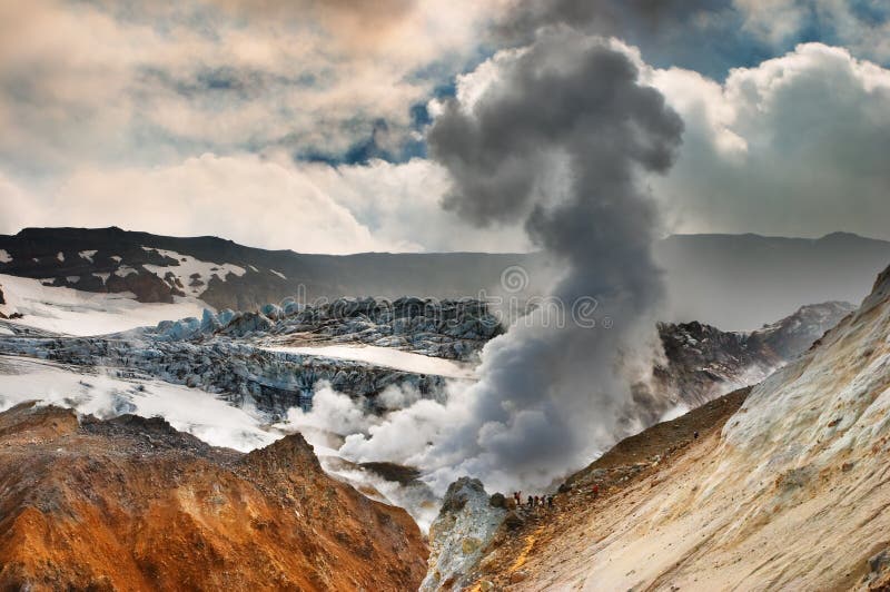 People inside active volcanic crater, Mutnovsky volcano, Kamchatka. People inside active volcanic crater, Mutnovsky volcano, Kamchatka