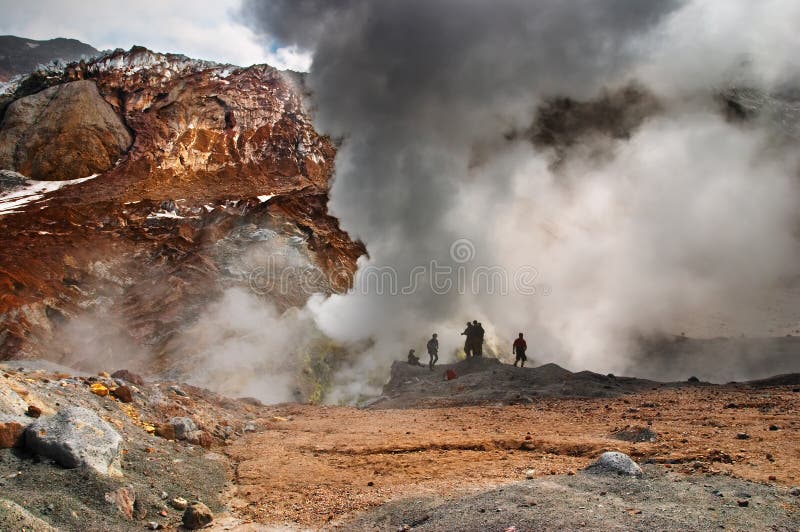 People inside active volcanic crater, Mutnovsky volcano, Kamchatka. People inside active volcanic crater, Mutnovsky volcano, Kamchatka