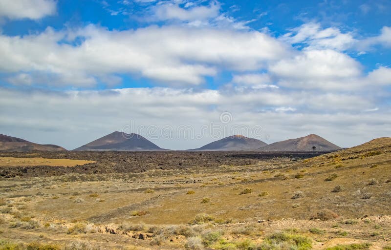 Volcanic hills in the desert landscape of the island of Lanzarote, which is a protected area of UNESCO