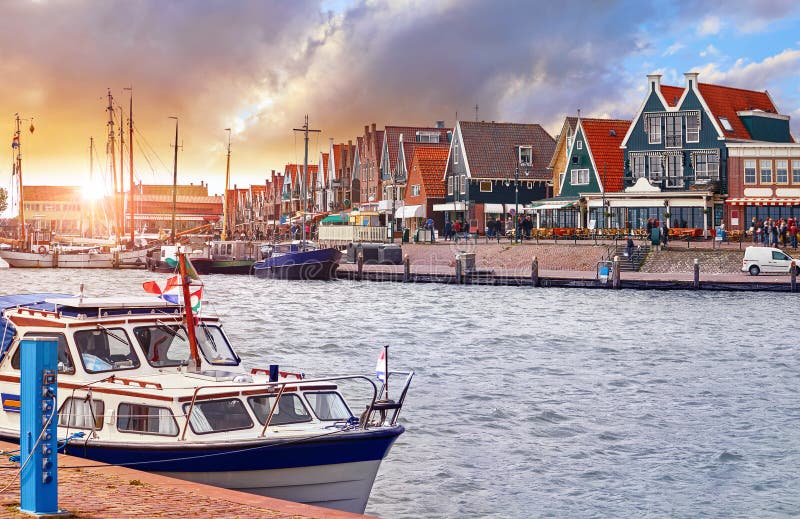 Volendam, Netherlands. Luxury yacht parked by pier on sunset