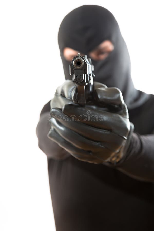 Voleur dirigeant une arme à feu photographie stock libre de droits