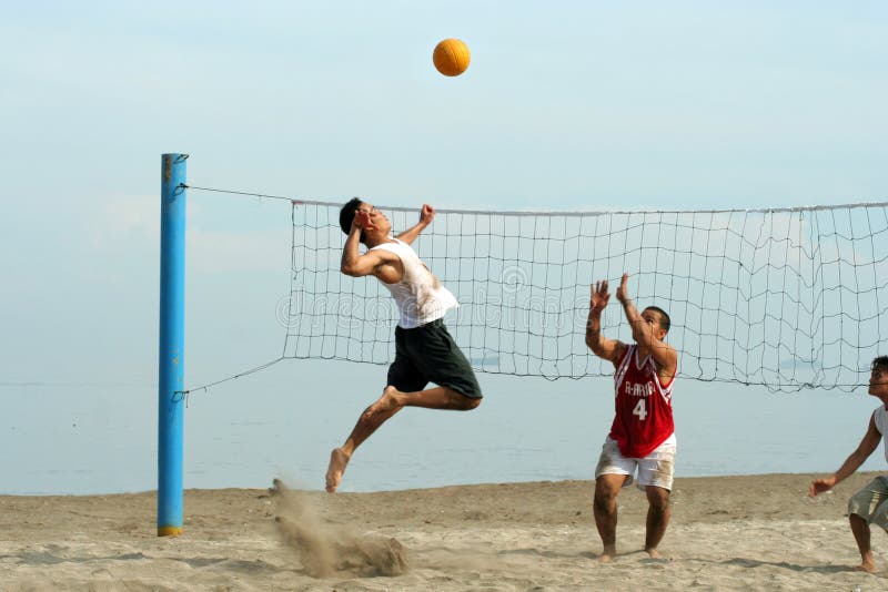 Volleyball on the beach stock image. Image of jump, casual 9501857