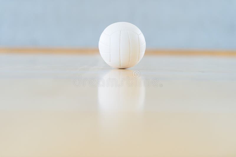 A Volleyball and Reflection on a Wooden Floor Stock Image Image of indoor, arena 175563973