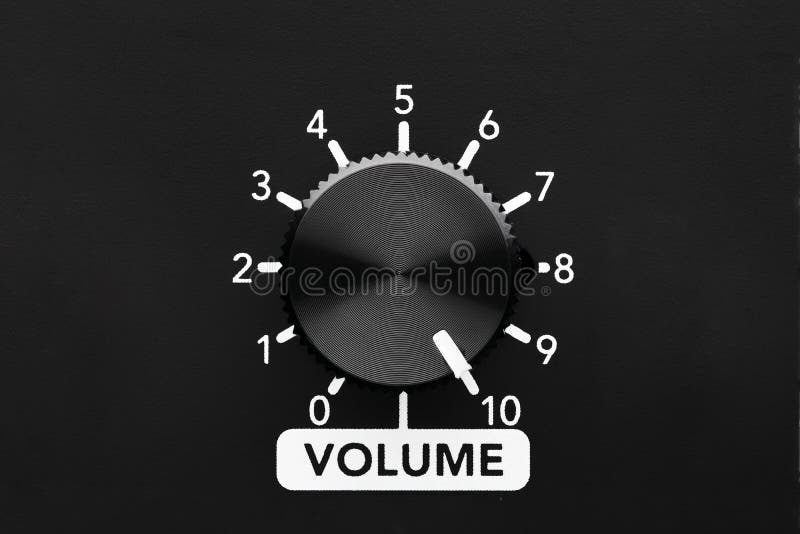 Volume control knob of a black amplifier on maxiumum loudness stock photo