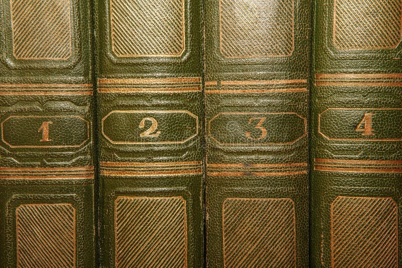 Volumes of old books with gold lettering on the cover